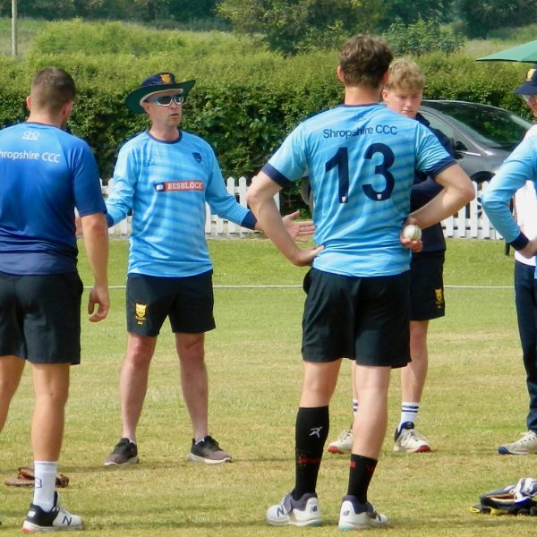 Ed-Home-with-the-Shropshire-players-before-facing-Norfolk-at-Whitchurch-scaled