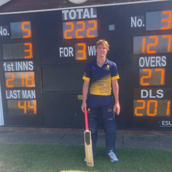 Harry Parton next to the scoreboard at Ombersley after hitting an unbeaten 127 for Shropshire Academy