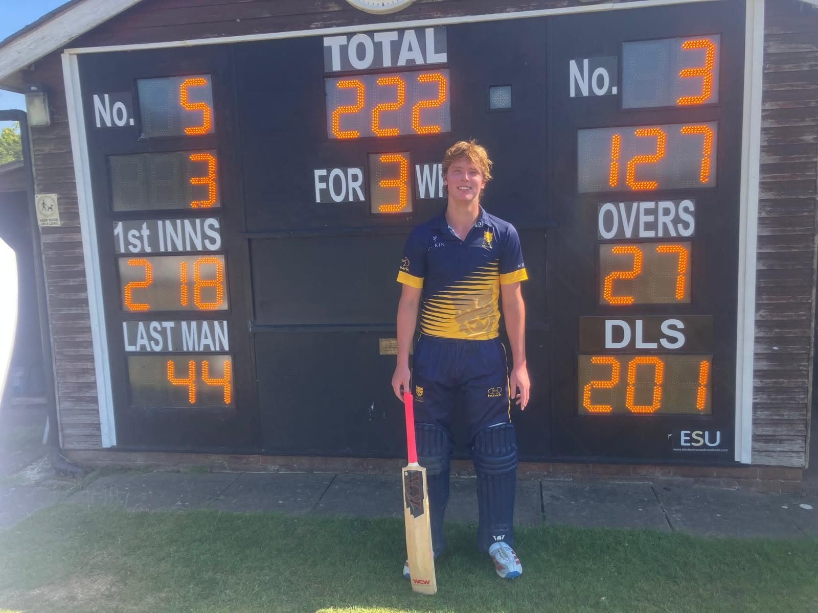 Harry Parton next to the scoreboard at Ombersley after hitting an unbeaten 127 for Shropshire Academy