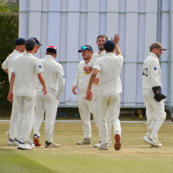 Roman Walker celebrates taking one of his seven wickets in Cheshire's first innings at Nantwich